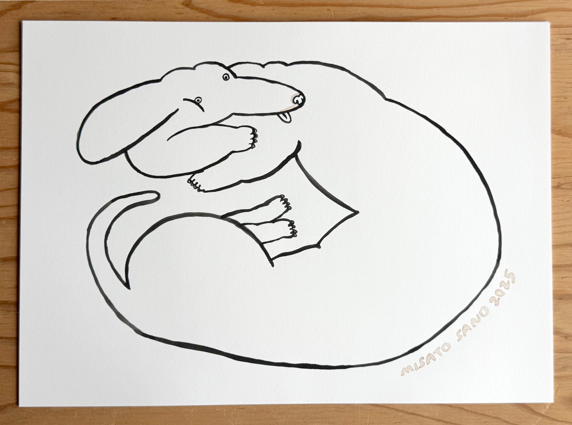 Black line drawing of a dog on a white sheet of paper 