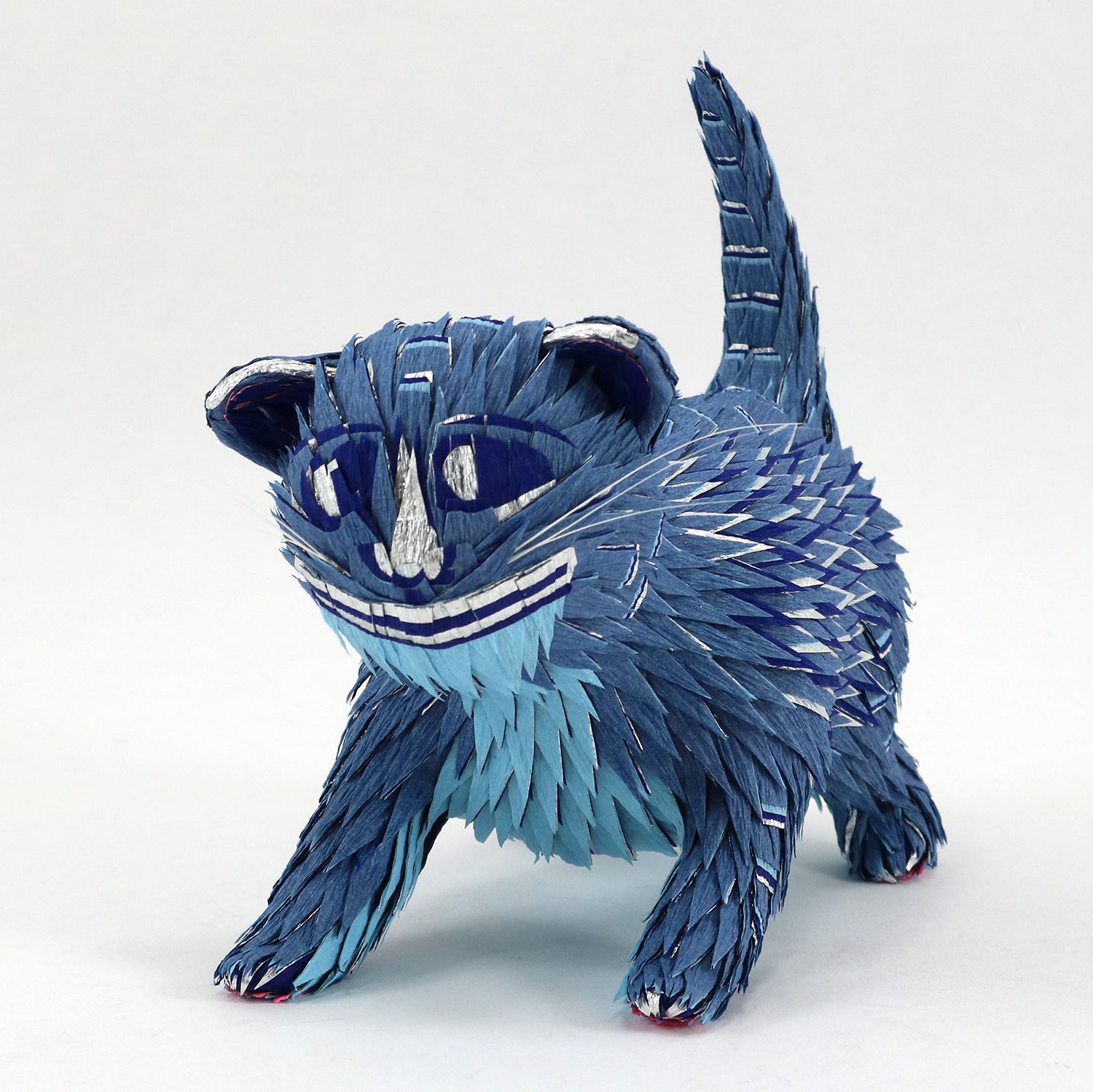 Blue cat-shaped plush toy on a white background