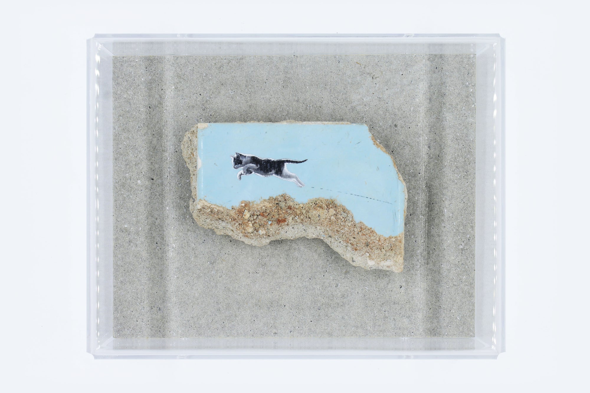 A cat painting on a textured surface