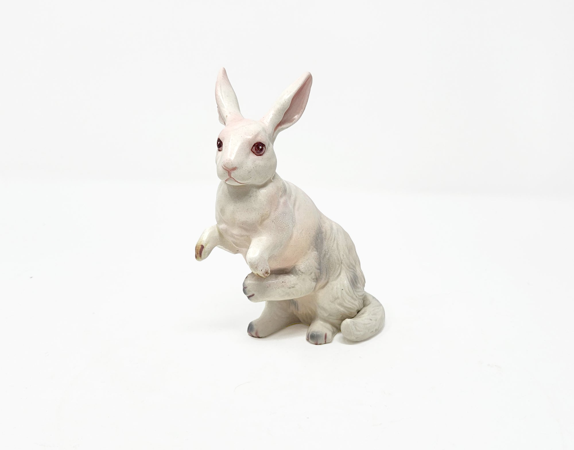 White rabbit figurine on a white background