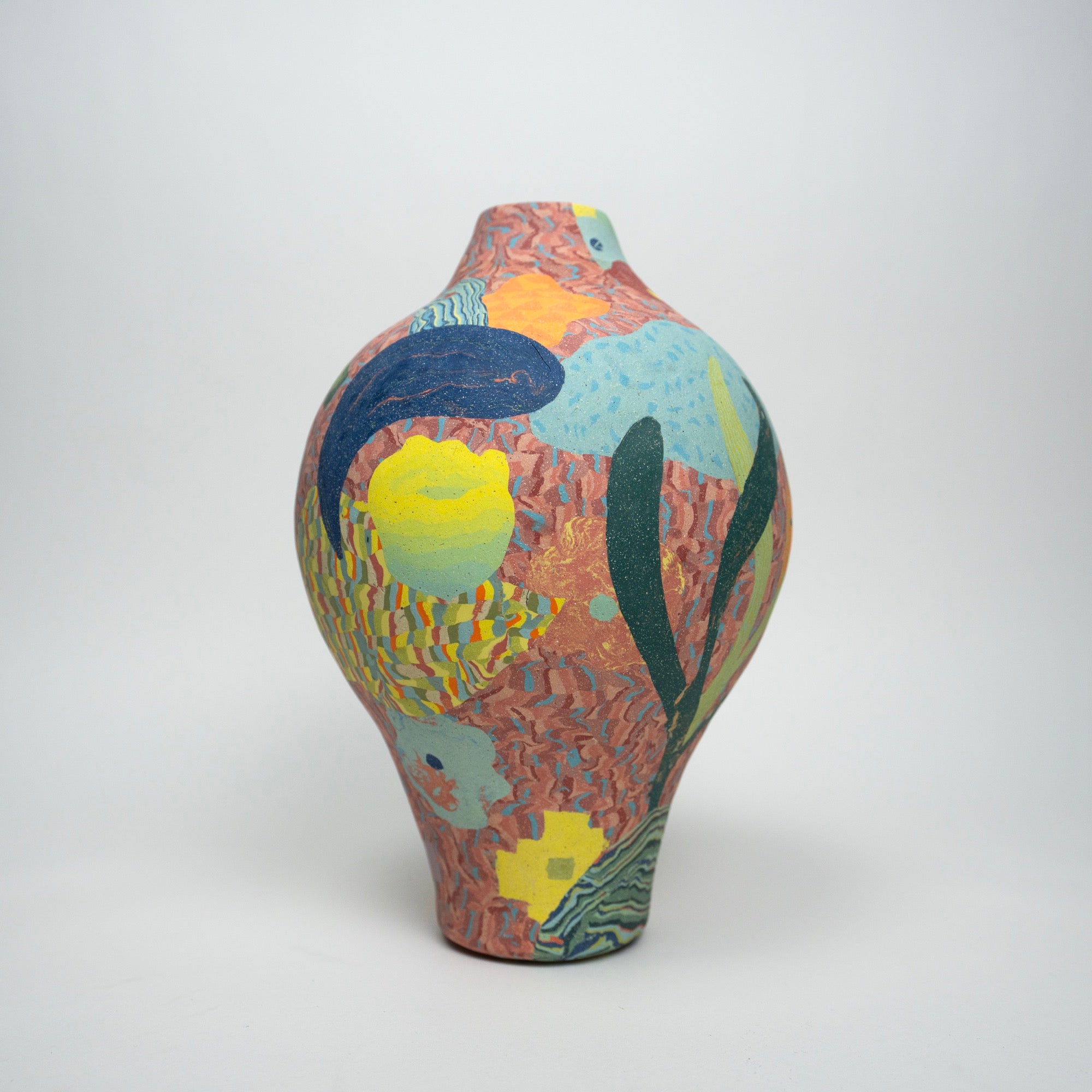 a colorful vessel with abstract flowers