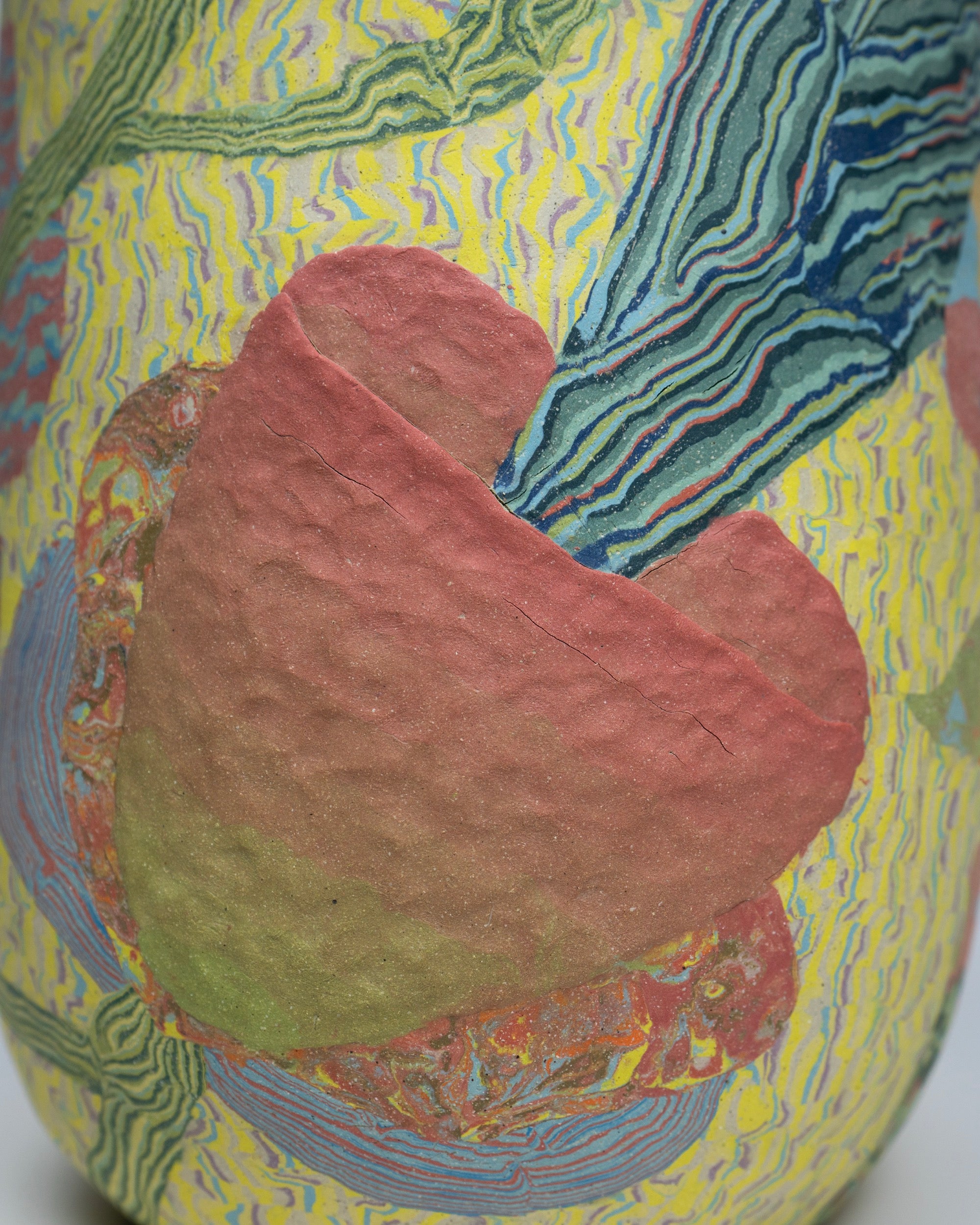 a colorful ovoid vase with flowers