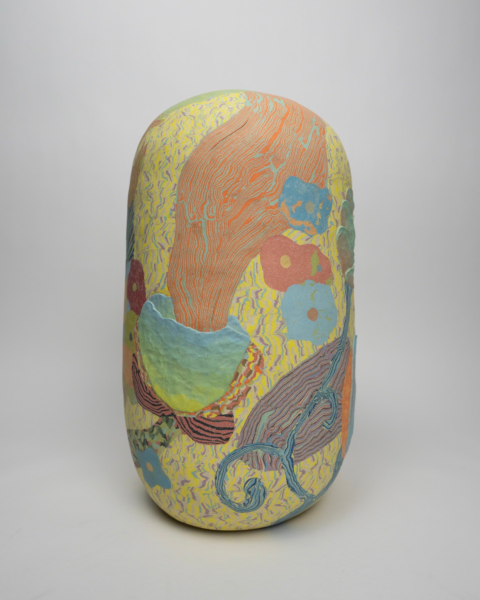 a colorful ovoid vase with flowers