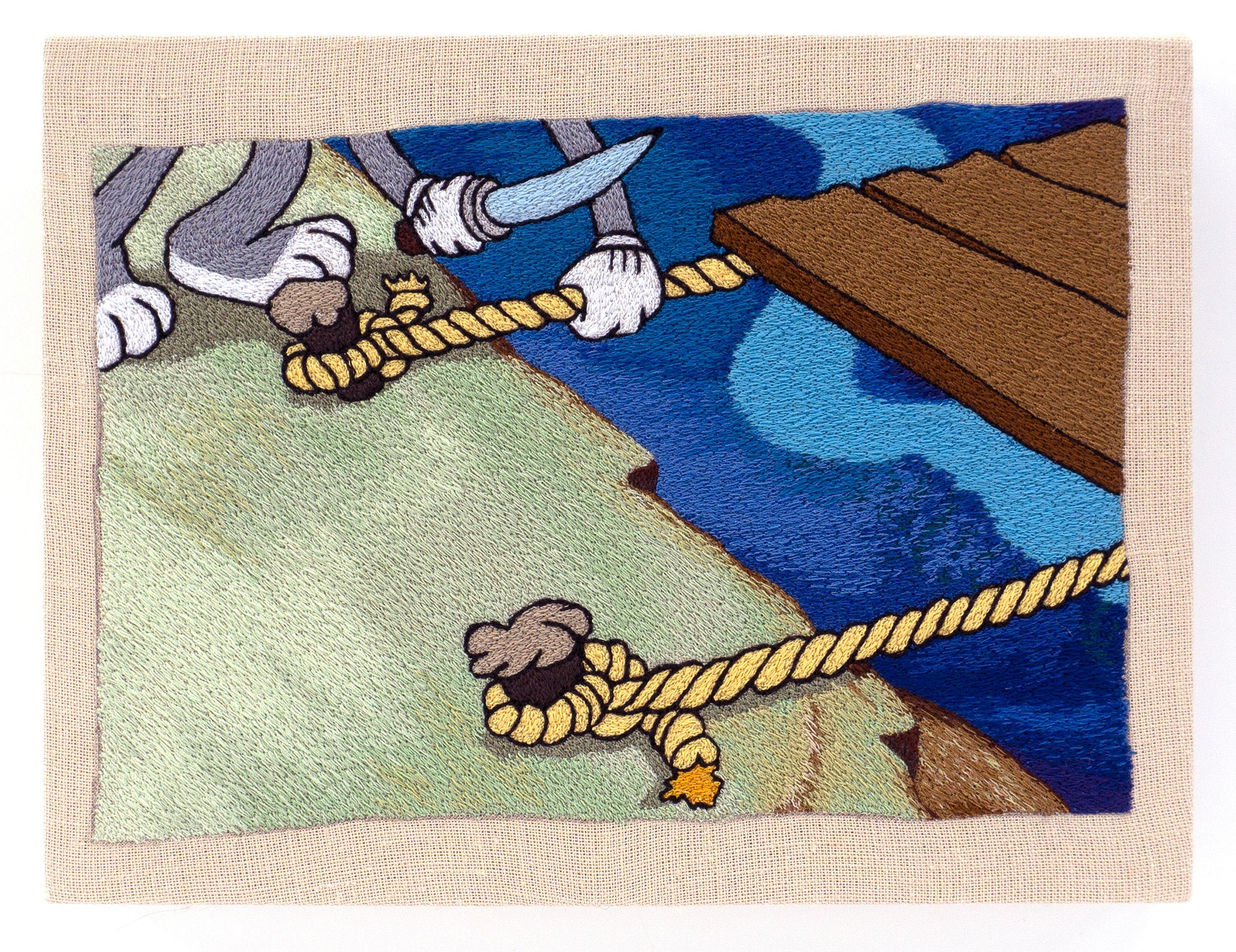 an embroidery of a cartoon figure cutting rope holding a wooden rig to a dock