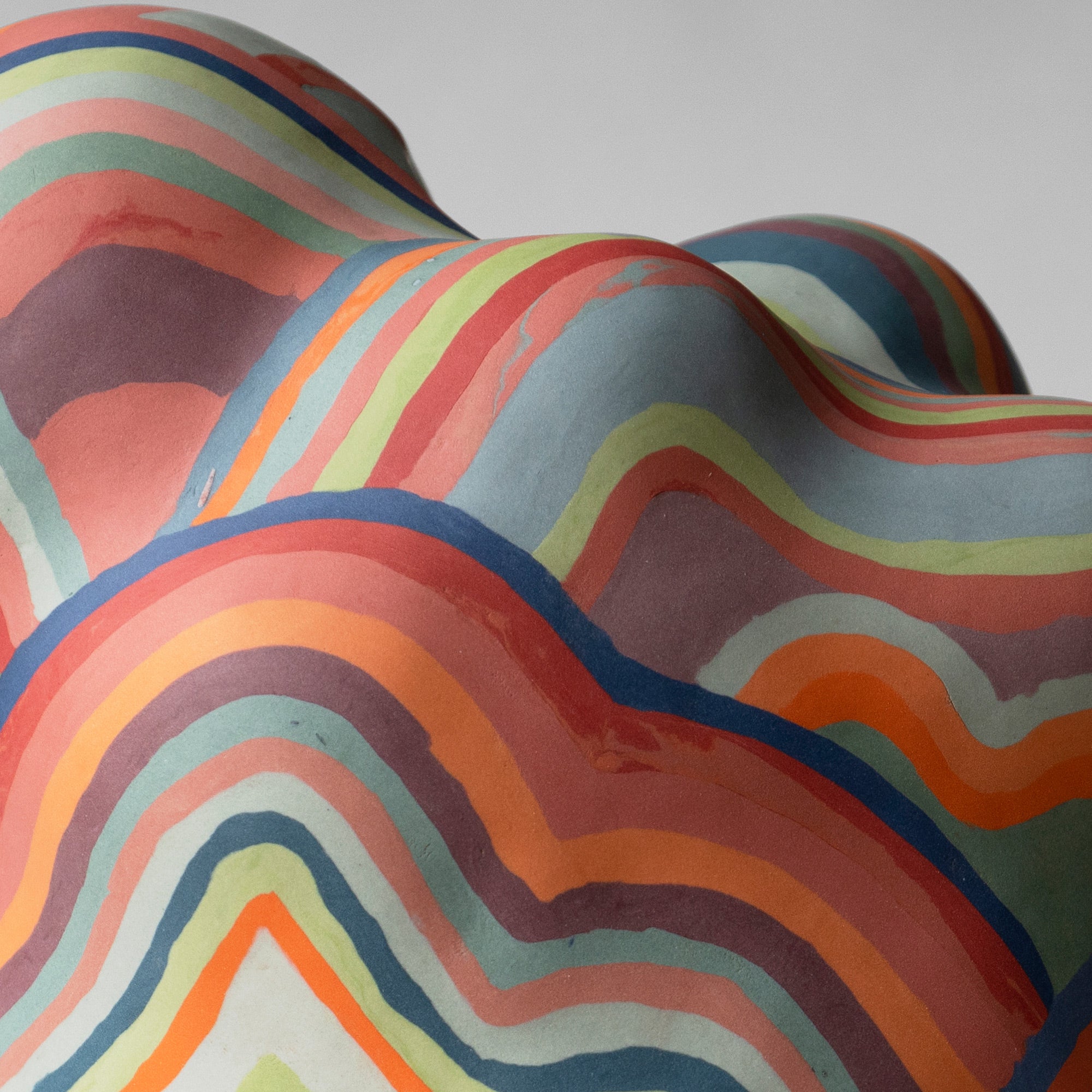 a colorful sculpture with wobbly lines and five legs